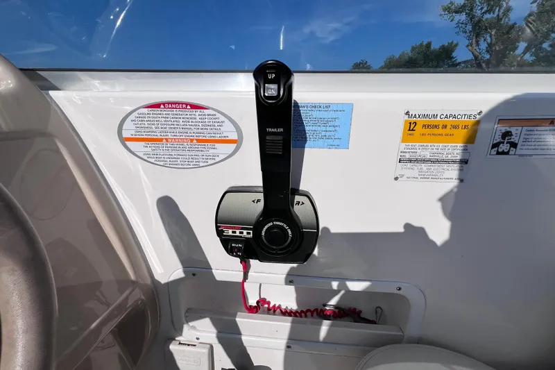 Slide: The Image of Control panel of a 1996 Chaparral 196 SSi boat with capacity warnings. - 24