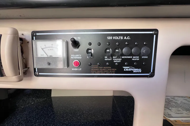 Slide: The Image of Control panel of a 1996 Chaparral 196 SSi boat, showing 120 volts A.C. settings. - 31