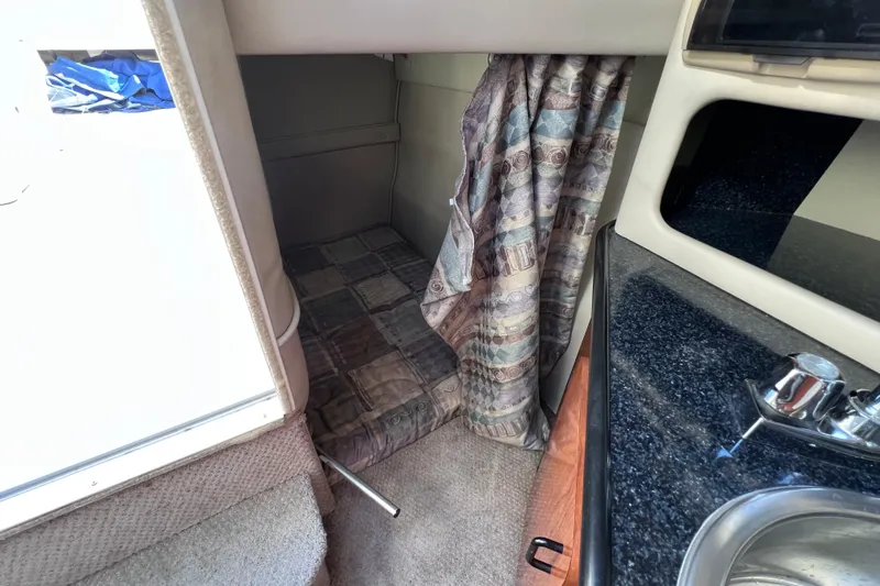 Slide: The Image of Interior cabin of 1996 Chaparral 196 SSi boat with bed and curtain. - 32