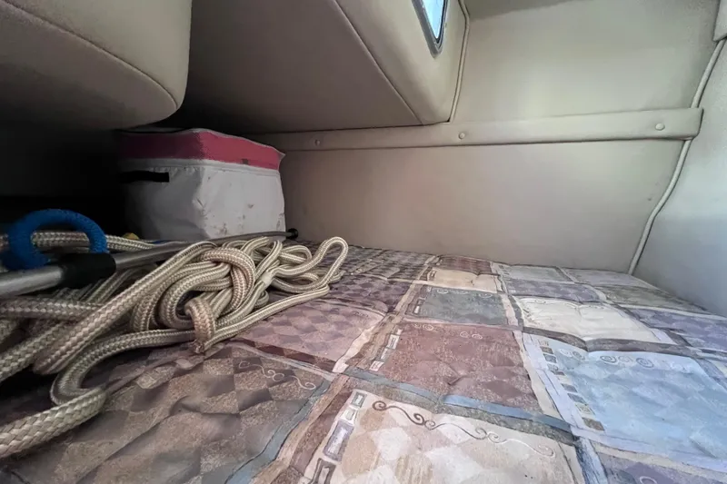 Slide: The Image of Interior of 1996 Chaparral 196 SSi boat with ropes and storage area. - 33