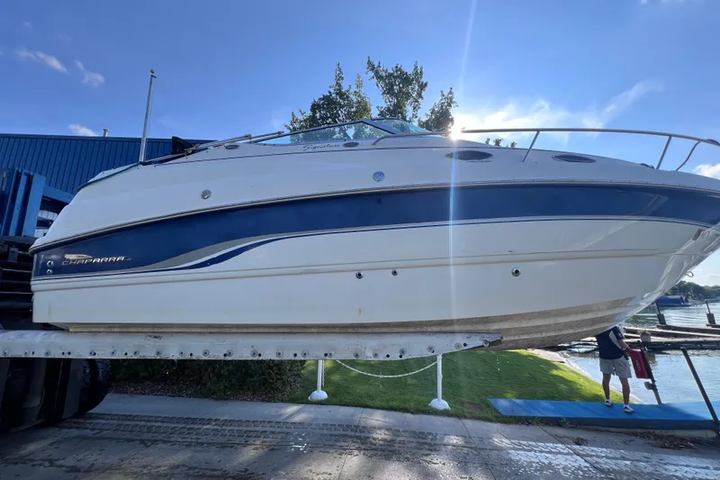 Slide: The Image of Chaparral 196 SSi 1996 boat on lift, blue and white design, sunny day. - 42