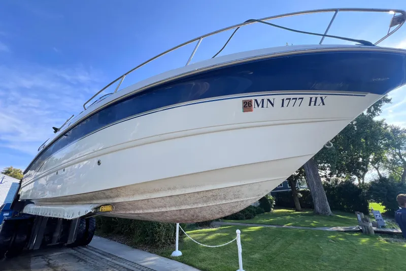 Slide: The Image of 1996 Chaparral 196 SSi boat on trailer, blue and white hull, registration MN 1777 HX. - 43