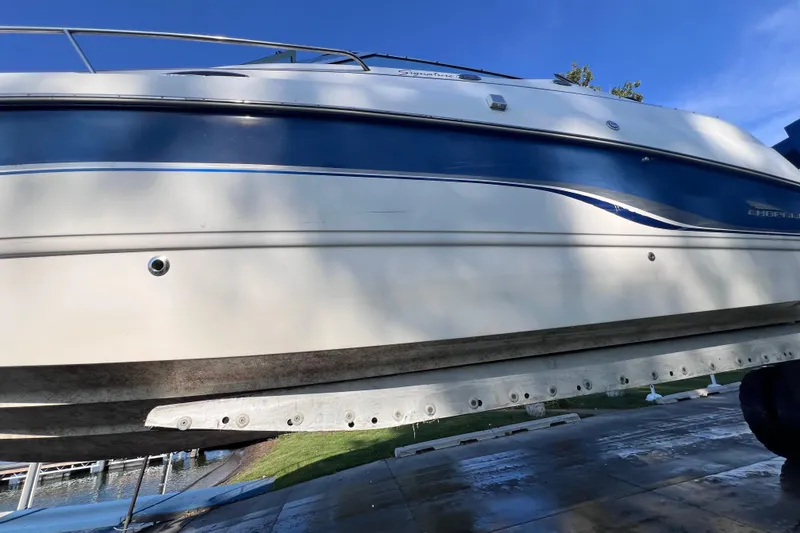 Slide: The Image of Chaparral 196 SSi 1996 boat on trailer, side view with blue stripe. - 45