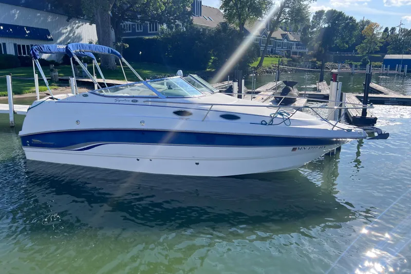 Slide: The Image of Chaparral 196 SSi 1996 boat docked on a sunny day with blue canopy. - 6