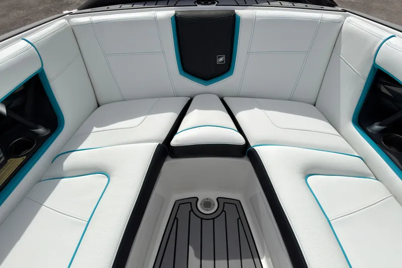 Slide: The Image of 2019 Nautique Super Air Nautique G23 Coastal Edition interior with white and teal seating. - 16