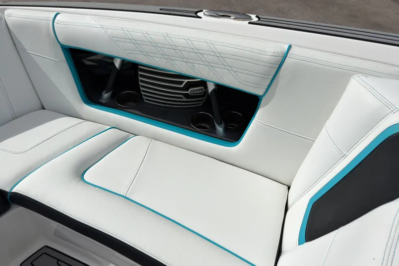 Slide: The Image of 2019 Nautique Super Air Nautique G23 Coastal Edition interior seating with cup holders and stylish stitching. - 17