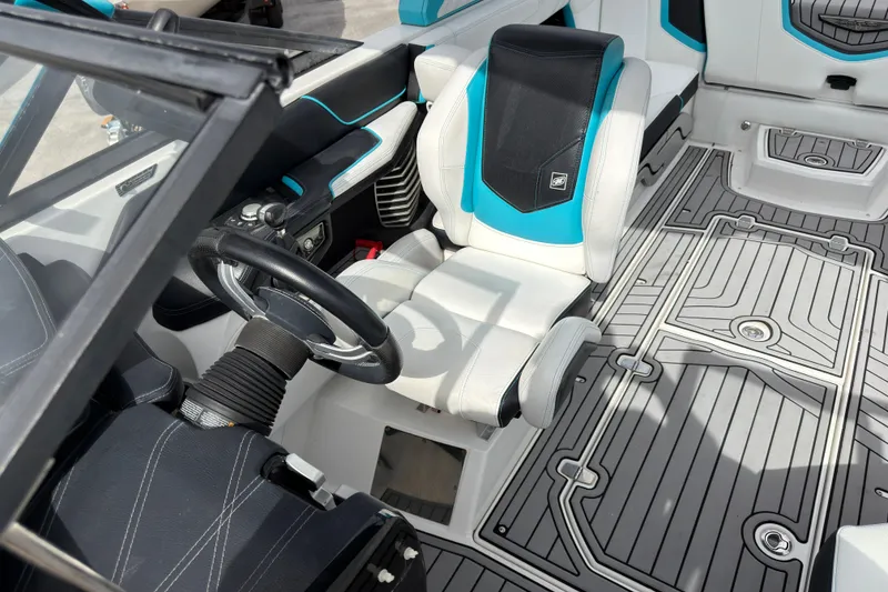 Slide: The Image of 2019 Nautique Super Air Nautique G23 Coastal Edition interior with sleek seating and modern dashboard. - 18