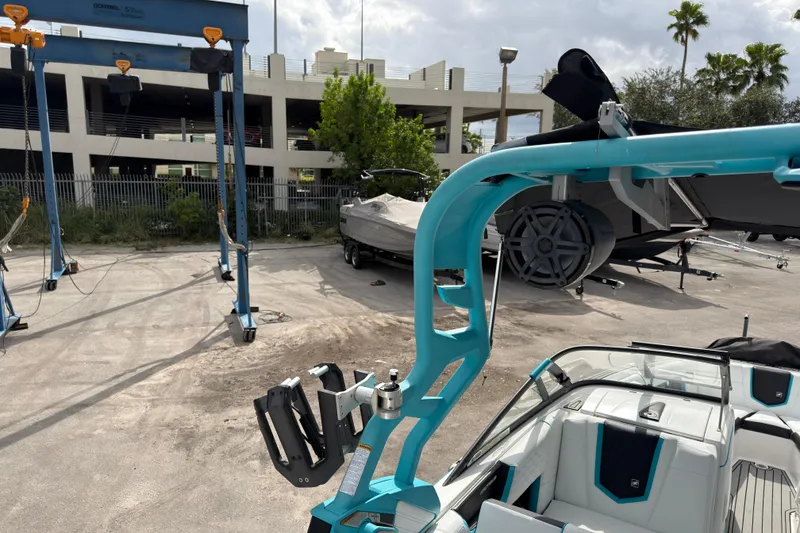 Slide: The Image of 2019 Nautique Super Air Nautique G23 Coastal Edition in a boatyard setting. - 24