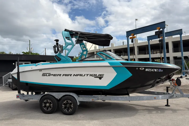 Slide: The Image of 2019 Nautique Super Air Nautique G23 Coastal Edition boat on trailer, side view. - 3