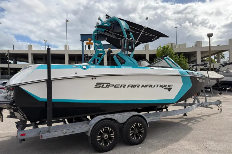 Slide: The Image of 2019 Nautique Super Air Nautique G23 Coastal Edition on trailer, parked outdoors. - 5