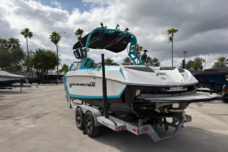 Slide: The Image of 2019 Nautique Super Air Nautique G23 Coastal Edition on trailer, parked outdoors. - 8