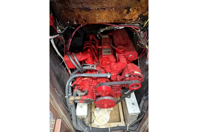 Slide: The Image of 1985 Morgan 384 yacht interior with patterned seating and wooden accents. - 4