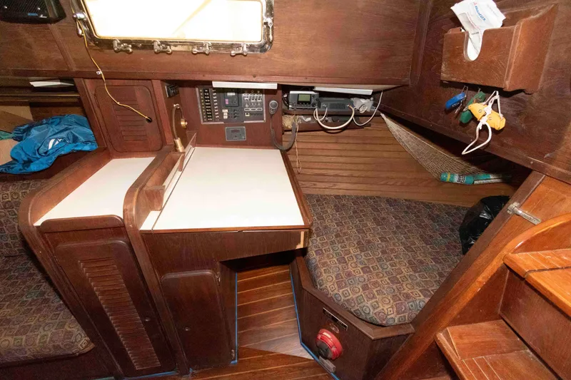 Slide: The Image of 1985 Morgan 384 yacht interior with navigation station and cozy seating area. - 8