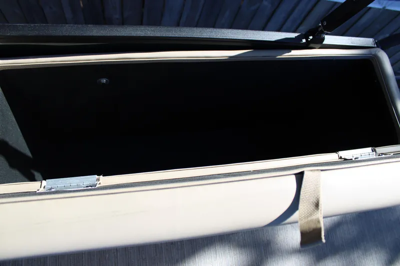 Slide: The Image of Open storage compartment of 2026 Starcraft EXS 3 Q boat, showcasing interior space. - 18