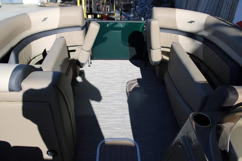 Slide: The Image of 2026 Starcraft EXS 3 Q boat interior with beige seating and modern design. - 27