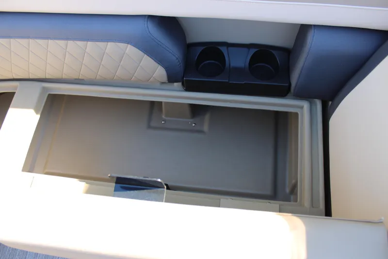 Slide: The Image of Interior storage compartment of 2026 Starcraft EXS 3 Q boat with cup holders. - 28