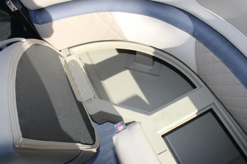 Slide: The Image of 2026 Starcraft EXS 3 Q boat interior storage compartment with cushioned seating. - 29