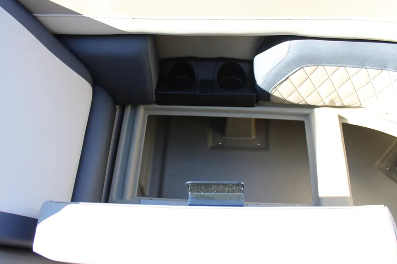 Slide: The Image of Interior of 2026 Starcraft EXS 3 Q boat with storage compartment and cup holders. - 30