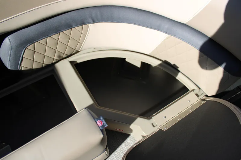 Slide: The Image of 2026 Starcraft EXS 3 Q boat interior storage compartment with quilted upholstery. - 31