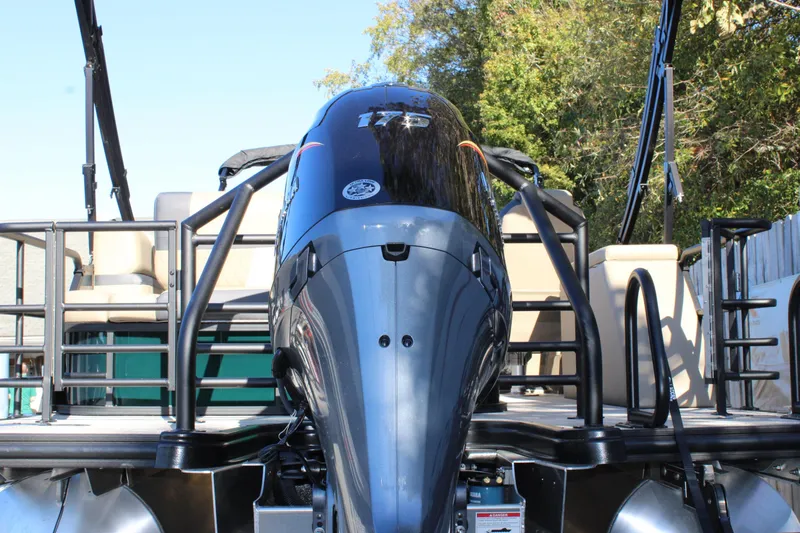 Slide: The Image of 2026 Starcraft EXS 3 Q boat with powerful outboard motor, docked outdoors. - 5