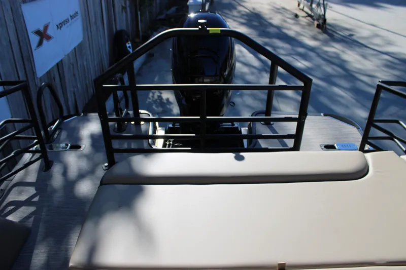 Slide: The Image of 2026 Starcraft EXS 3 Q boat deck with seating and railing, outdoor setting. - 8