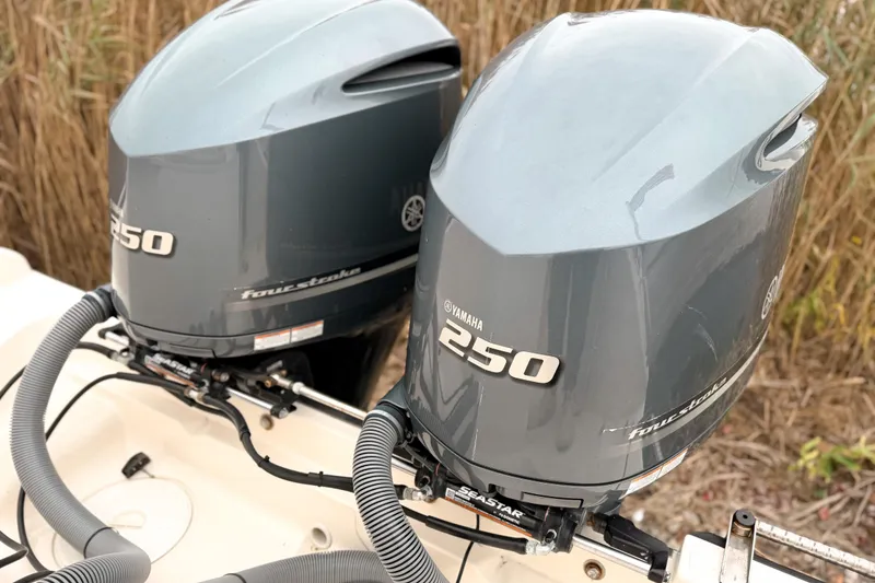 Slide: The Image of Twin Yamaha 250 outboard engines on a 2014 Pursuit S 280 Sport boat. - 4