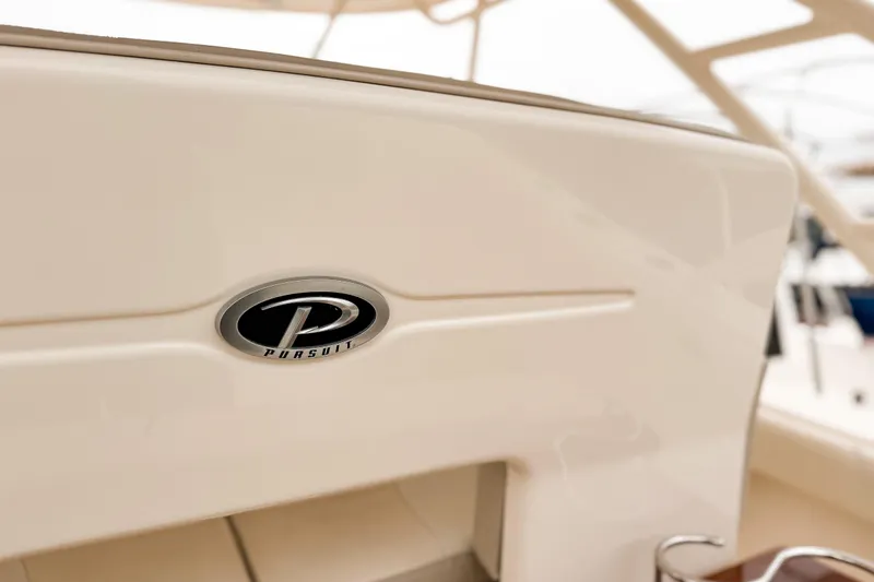 Slide: The Image of 2014 Pursuit S 280 Sport boat interior with logo detail. - 9