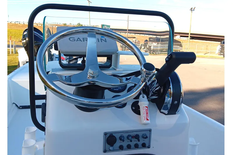 Slide: The Image of 2014 Sundance K16CC boat console with Garmin navigation and Mercury controls. - 12