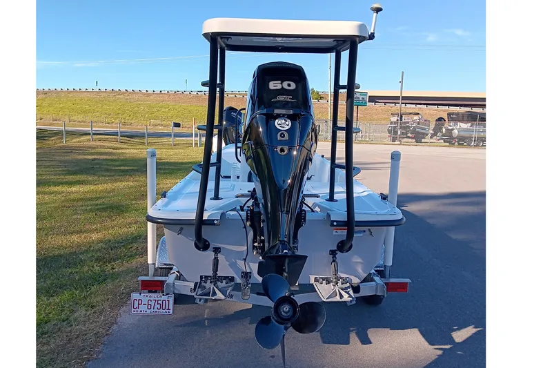 Slide: The Image of 2014 Sundance K16CC boat with 60 HP outboard motor on trailer. - 5