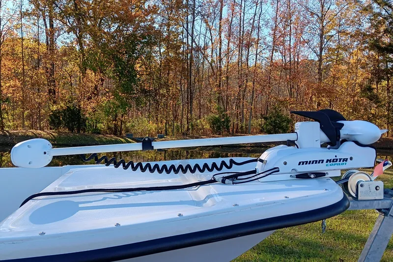 Slide: The Image of 2014 Sundance K16CC boat with Minn Kota Copilot trolling motor in autumn setting. - 7