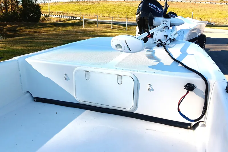 Slide: The Image of 2014 Sundance K16CC boat with Mercury motor, parked on a sunny day. - 9