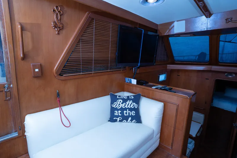 Slide: The Image of Interior of 1991 Marine Trader 46 fast trawler with cozy seating and decor. - 19