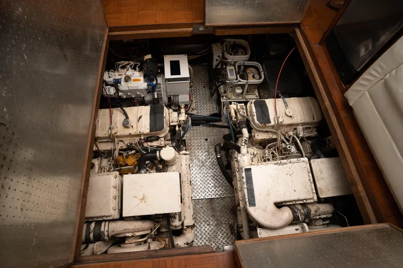 Slide: The Image of Engine room of a 1991 Marine Trader 46 fast trawler, showcasing dual engines. - 34
