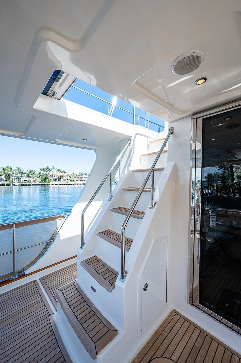 Slide: The Image of Staircase on 2013 Grand Banks 54 Europa yacht with teak decking and waterfront view. - 13