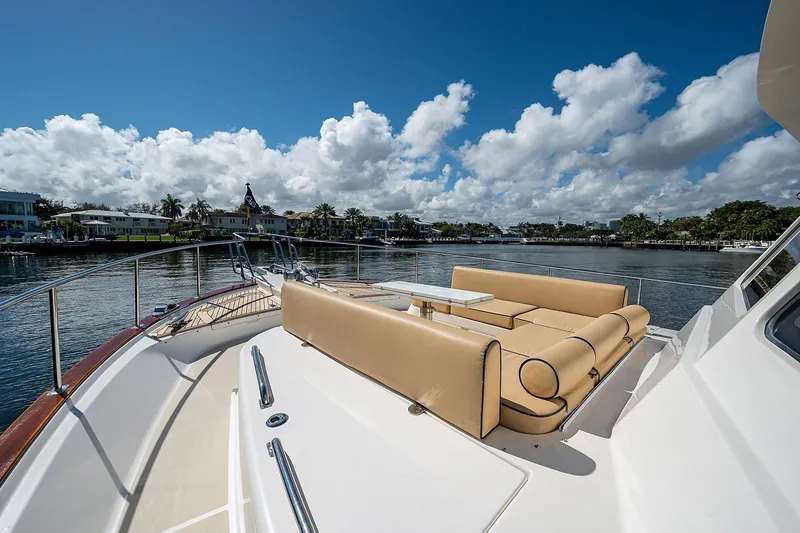 Slide: The Image of Luxurious 2013 Grand Banks 54 Europa yacht with tan seating, cruising on a sunny day. - 17