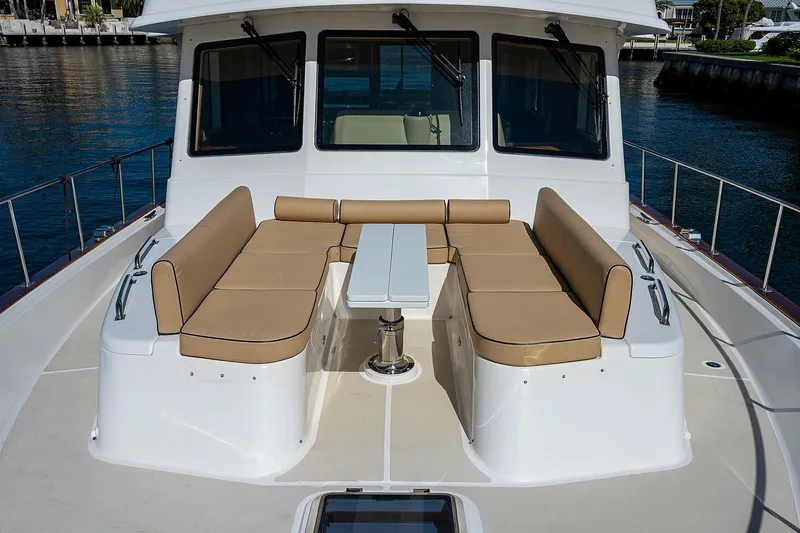 Slide: The Image of 2013 Grand Banks 54 Europa yacht with spacious outdoor seating area. - 22