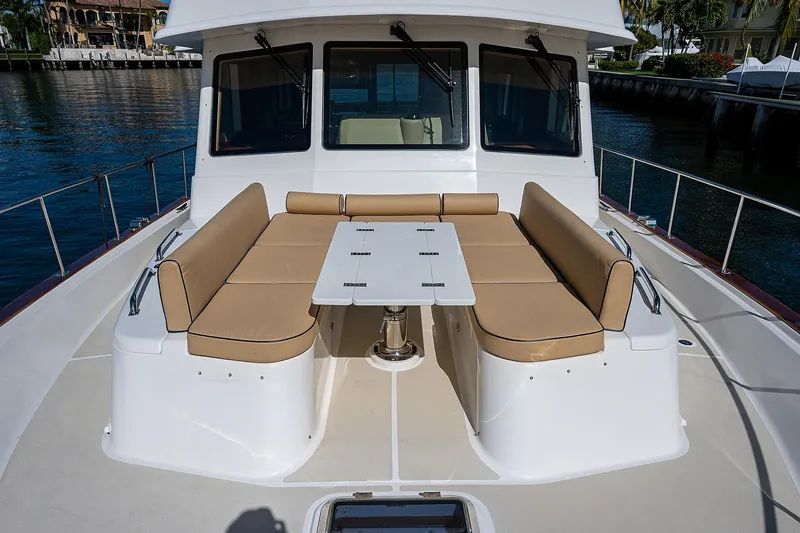 Slide: The Image of Grand Banks 54 Europa 2013 yacht with outdoor seating and table on deck. - 23