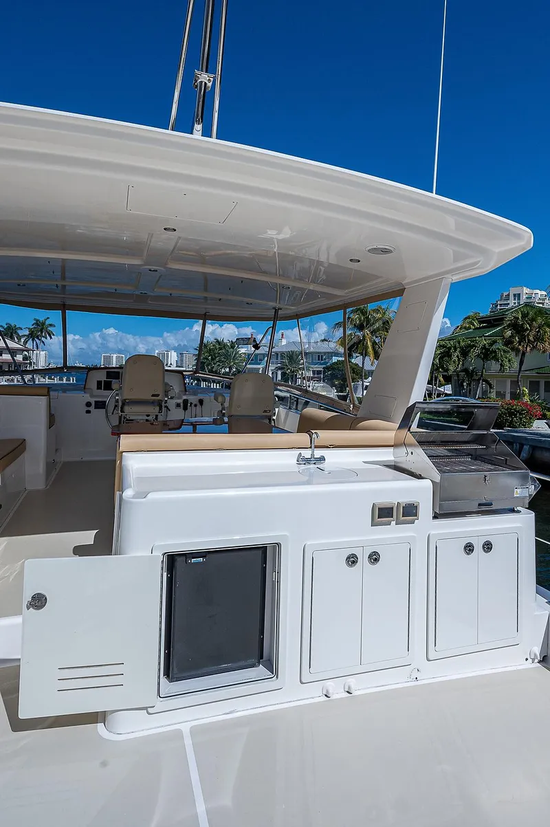 Slide: The Image of 2013 Grand Banks 54 Europa yacht with outdoor kitchen and seating area. - 27