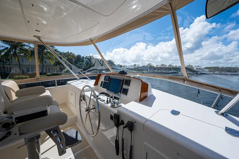 Slide: The Image of Helm of 2013 Grand Banks 54 Europa yacht with scenic waterway view. - 29