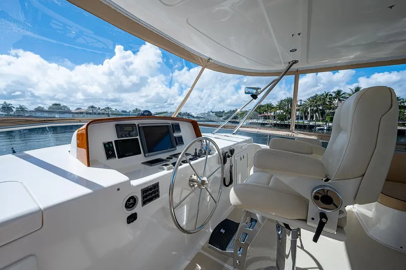 Slide: The Image of Helm of 2013 Grand Banks 54 Europa yacht with luxurious seating and navigation equipment. - 30