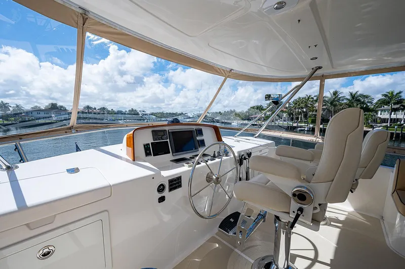 Slide: The Image of Luxurious helm of 2013 Grand Banks 54 Europa yacht with scenic waterfront view. - 31