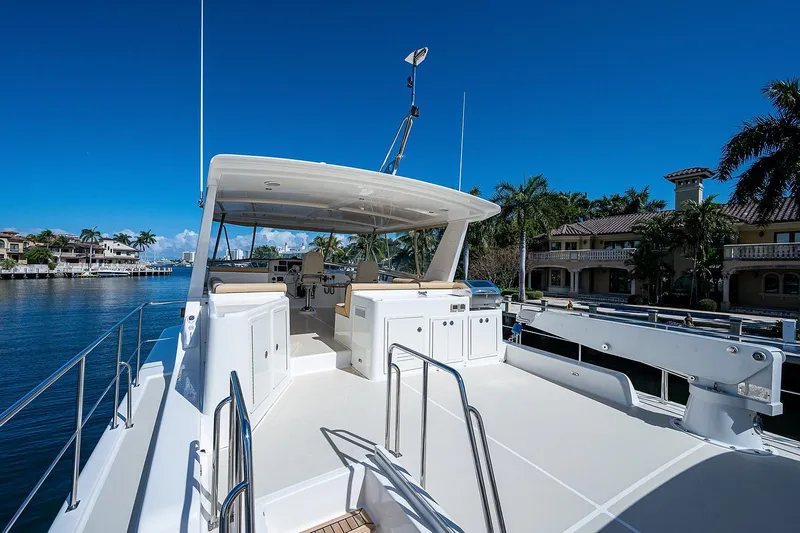 Slide: The Image of 2013 Grand Banks 54 Europa yacht deck with sleek design and waterfront view. - 41