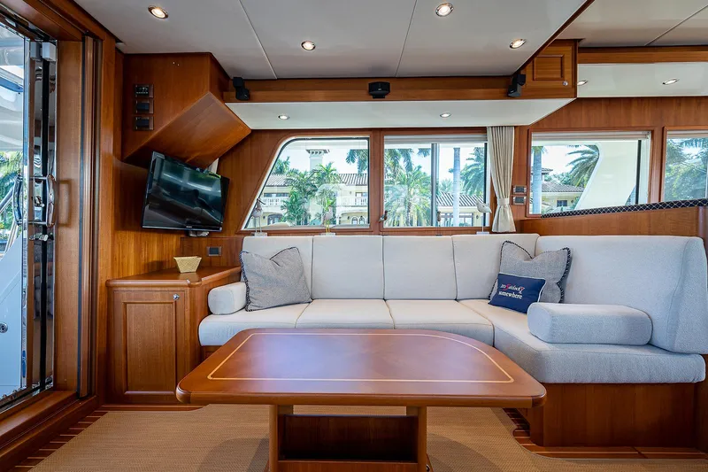 Slide: The Image of Luxurious interior of 2013 Grand Banks 54 Europa yacht with elegant wood finish and cozy seating. - 48