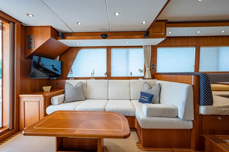 Slide: The Image of Luxurious interior of 2013 Grand Banks 54 Europa yacht with elegant wood finishes and cozy seating. - 49