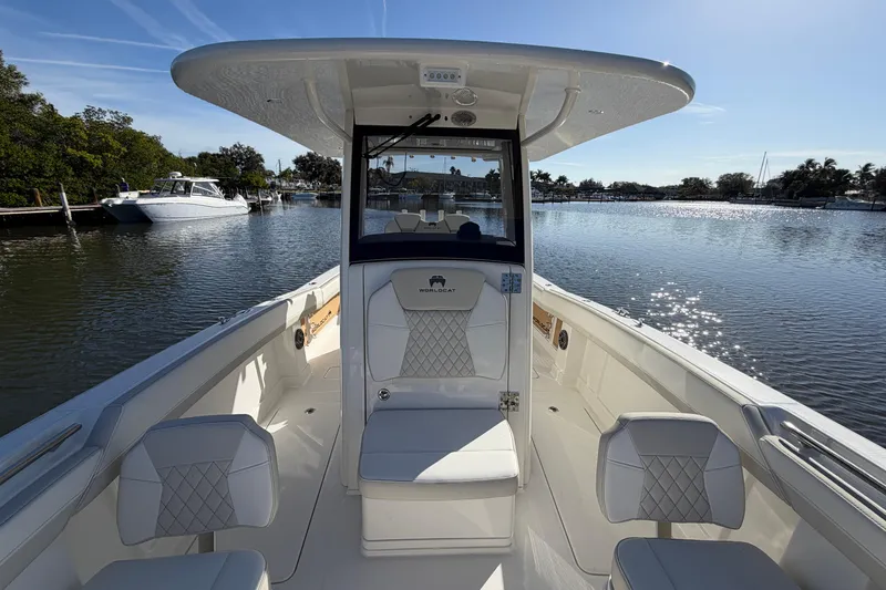 Slide: The Image of 2026 World Cat 280 CC-X boat interior with luxurious seating on a sunny day. - 14