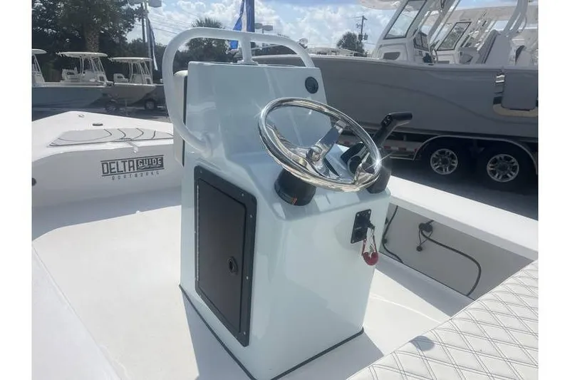Slide: The Image of 2026 Delta Boatworks D18 steering console with sleek design and modern controls. - 3