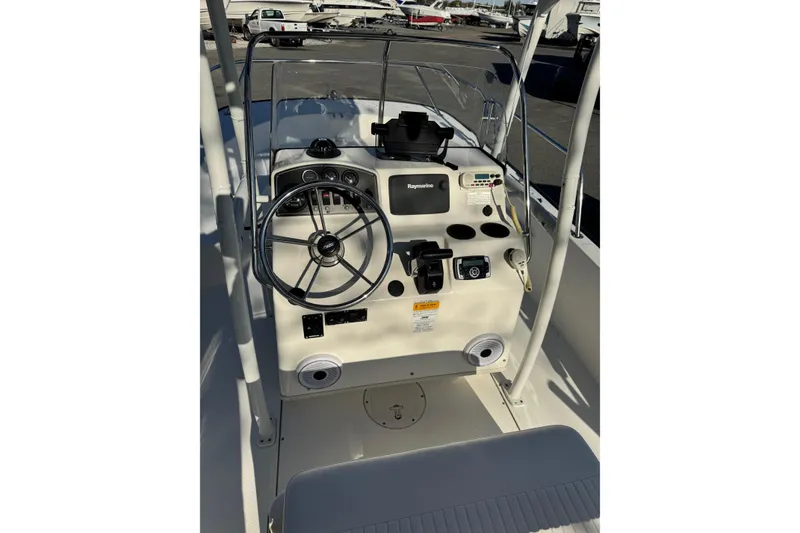 Slide: The Image of 2015 Boston Whaler 190 Montauk boat console with steering wheel and navigation equipment. - 7
