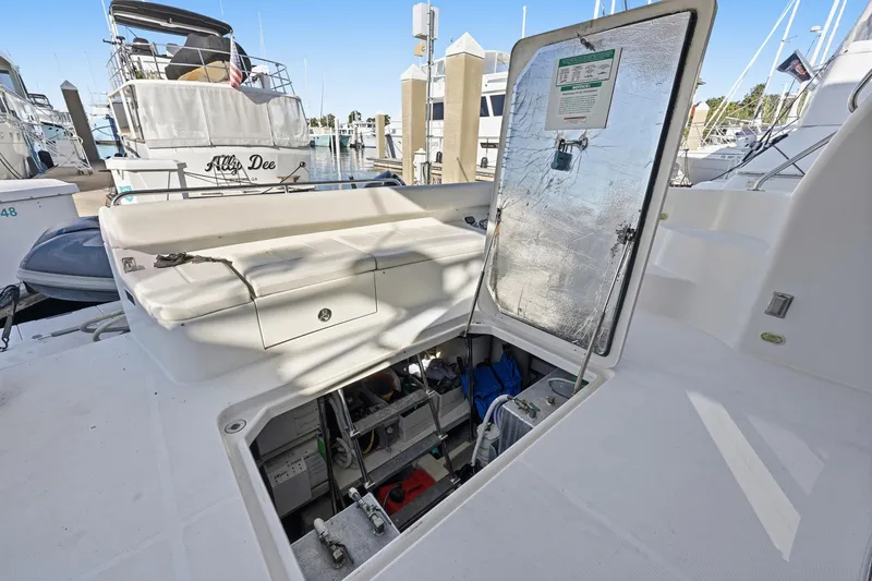 Slide: The Image of Open hatch on 2006 Carver 56 Voyager yacht, revealing storage and equipment. - 16
