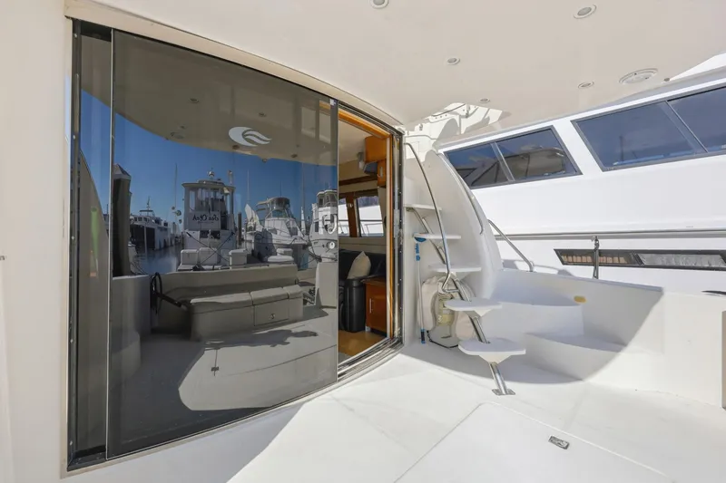 Slide: The Image of 2006 Carver 56 Voyager yacht with sleek interior and marina view. - 18
