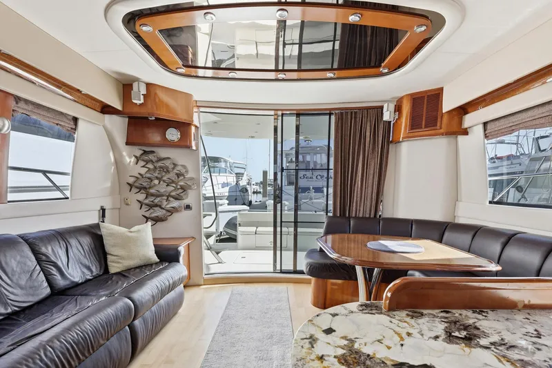 Slide: The Image of Luxurious interior of 2006 Carver 56 Voyager yacht with elegant seating and decor. - 20